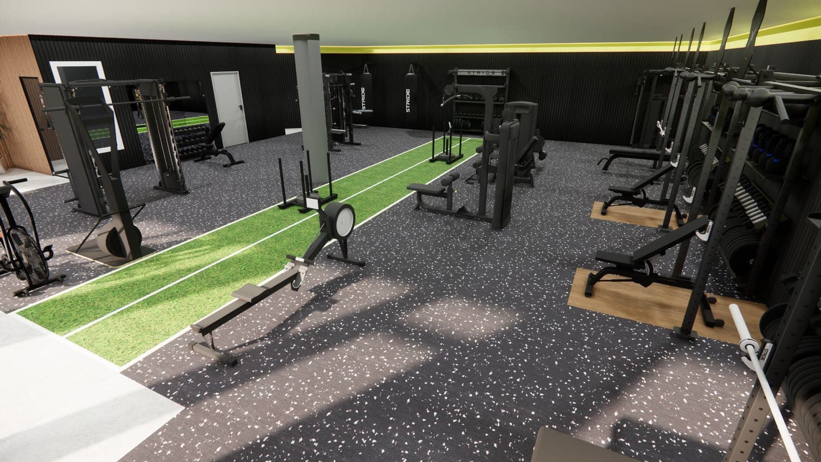 Overzicht van de trainingszaal met turfbaan in het midden
